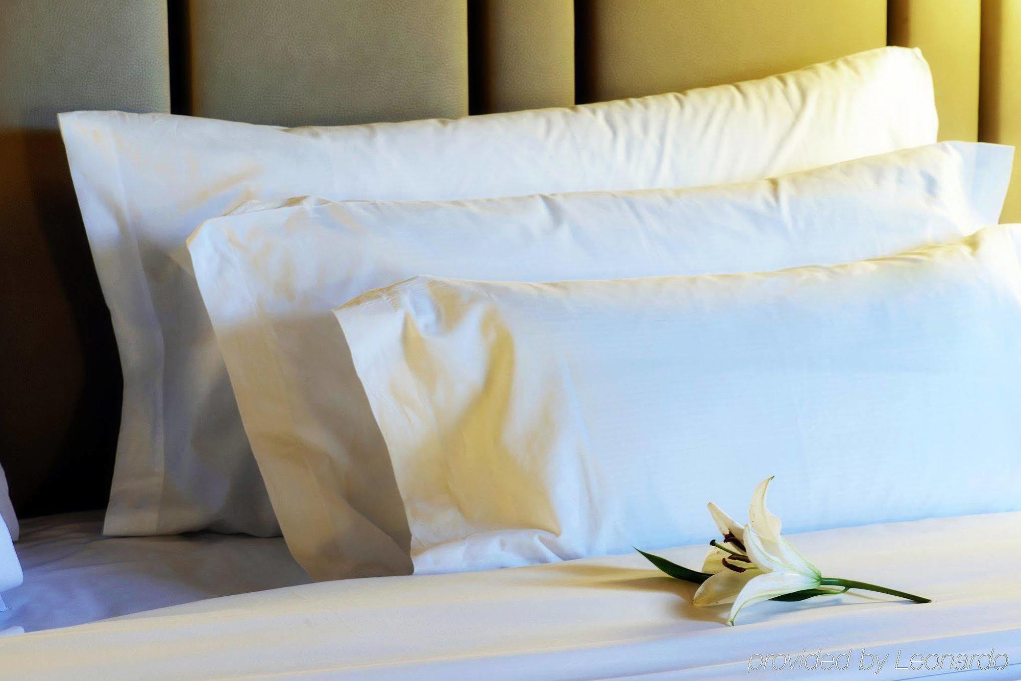 Nh Collection Madrid Palacio De Tepa Exterior photo Pillows on a bed